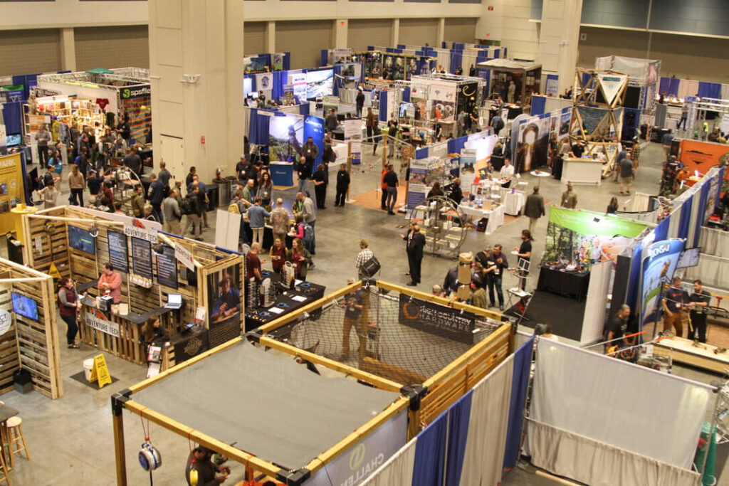 The Exhibit Hall is seen from above as it fills with attendees ready to greet exhibitors and sponsors.