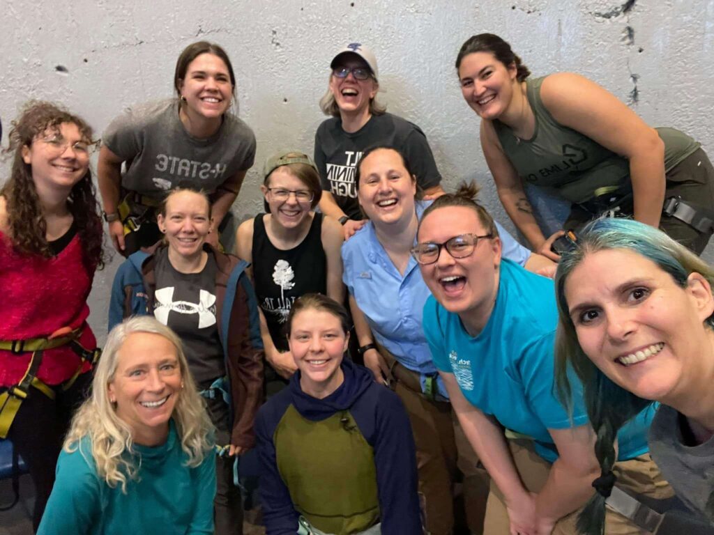 Members of the Women of ACCT Affinity Group gather at a local rock climbing venue during the 2024 annual conference and exposition.