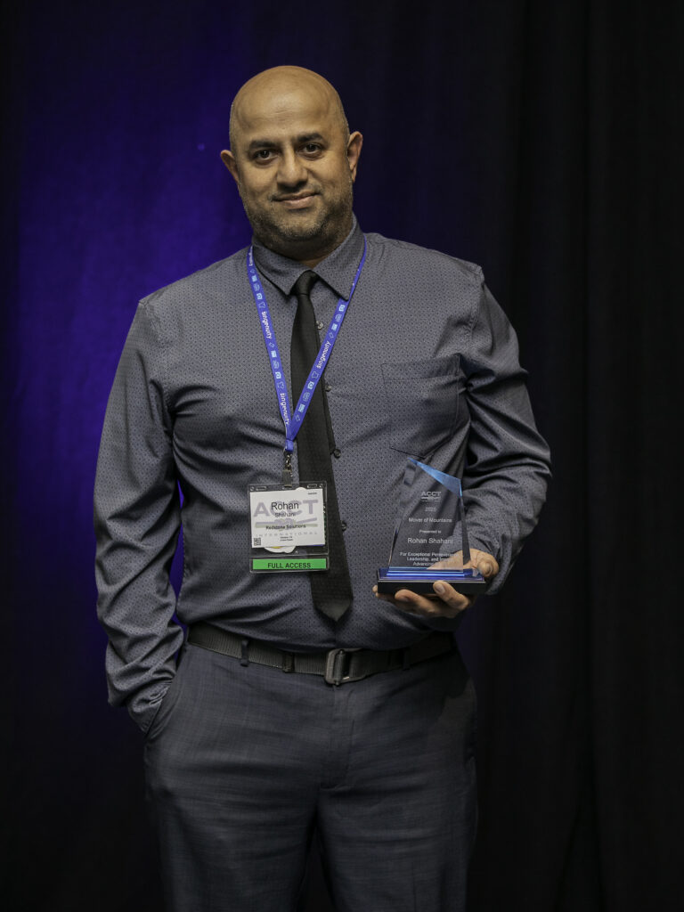 Rohan Shahani holds the first Mover of Mountains award, which he earned during the Awards Ceremony at the 2025 ACCT conference and exposition.