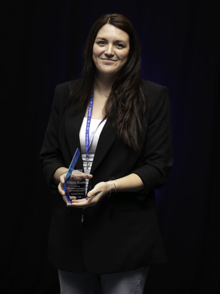 Alicia Bourke holds the Volunteer of the Year Award after earning the award during the Awards Ceremony at the 2025 ACCT conference and exposition.