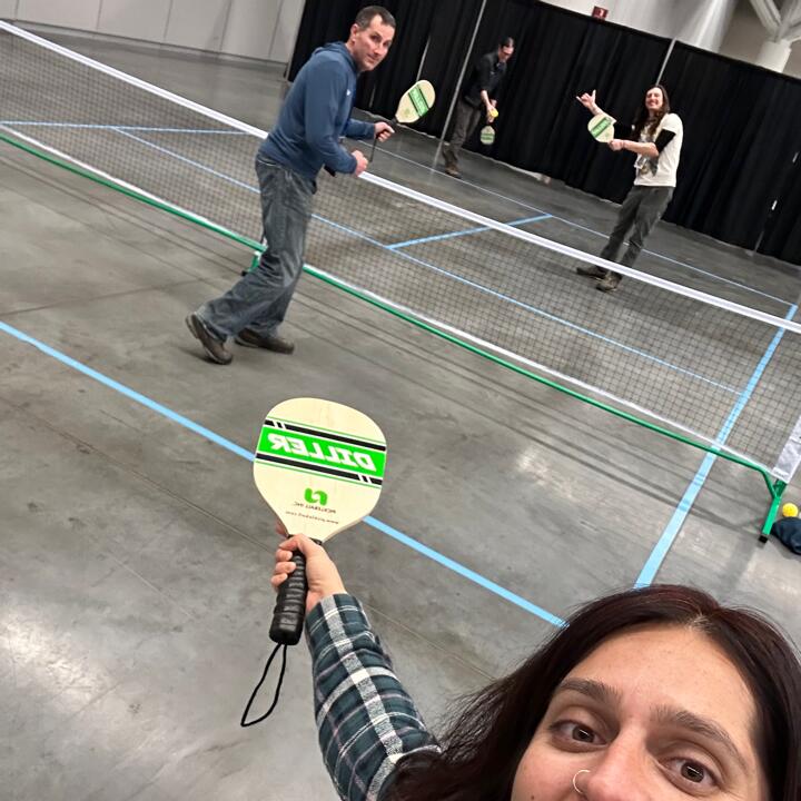 Four members of the Harnessing ACCT team Big Bubbles, No Troubles play pickleball thanks to the set loaned to ACCT International by the Cuyahoga Community College in the Exhibit Hall during the 2025 conference and exposition.