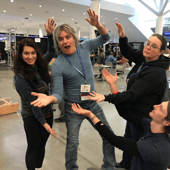 Three members of the Harnessing ACCT team Big Bubbles, No Troubles highlight Don Stock, who hosts a podcast, in the Exhibit Hall during the 2025 conference and exposition.