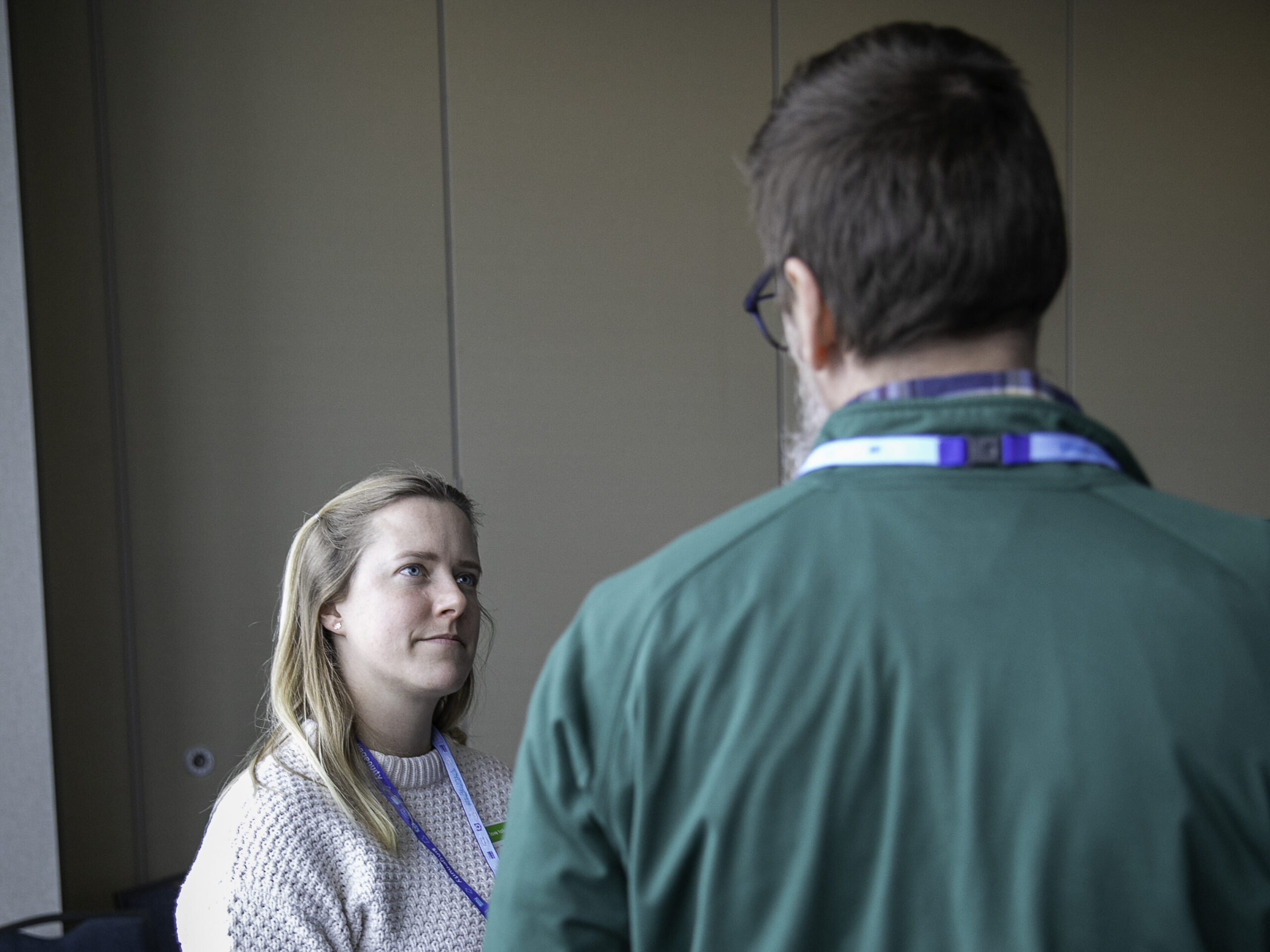 One attendee listens to another while mingling during an activity at the 2025 ACCT conference and exposition.